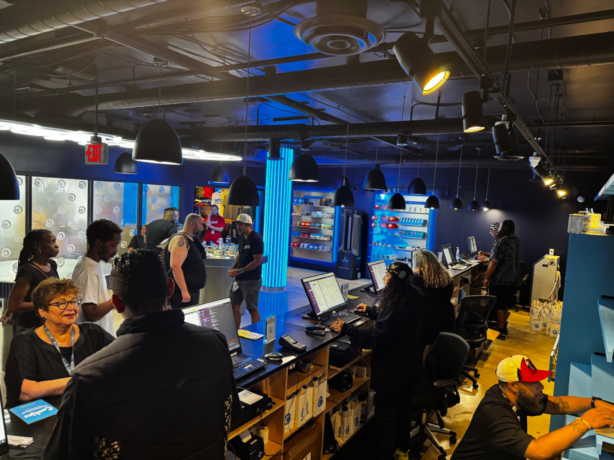 Active cannabis retail floor with customers and staff